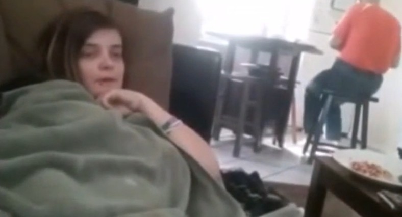 Her boyfriend films her fingering her pussy while dad is the kitchen behind her, i guess she likes a good dare